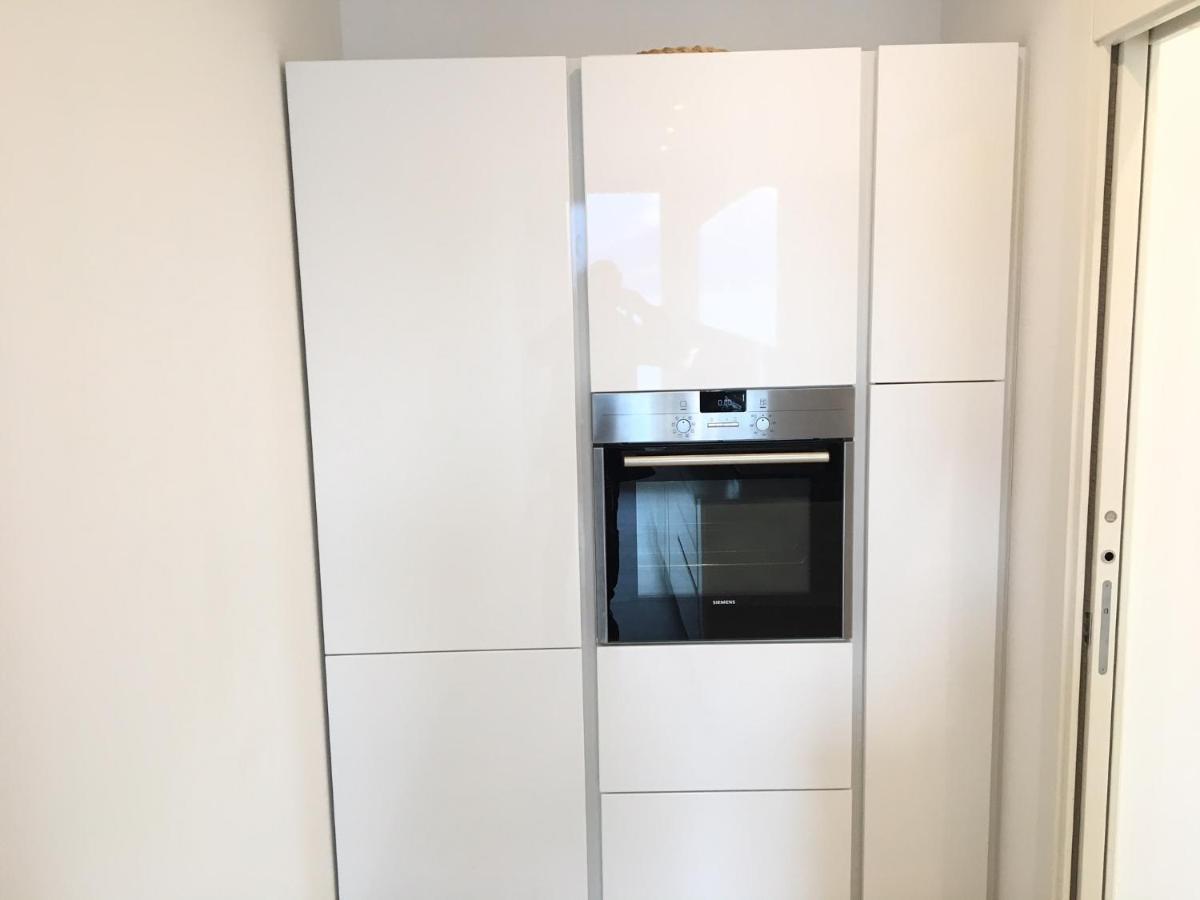 דירות לואינו Attico Palazzo Di Vetro מראה חיצוני תמונה